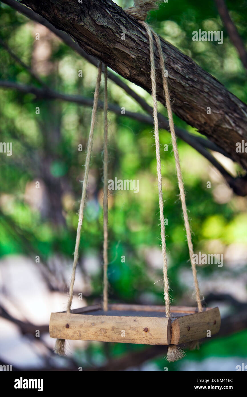 Wooden Bird Feeder Hanging On The Tree Branch Stock Photo