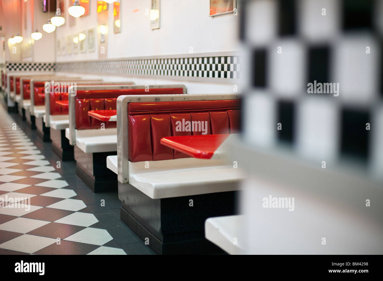 1950's style restaurant with checkered floor and rock'n'roll memorabilia. Stock Photo