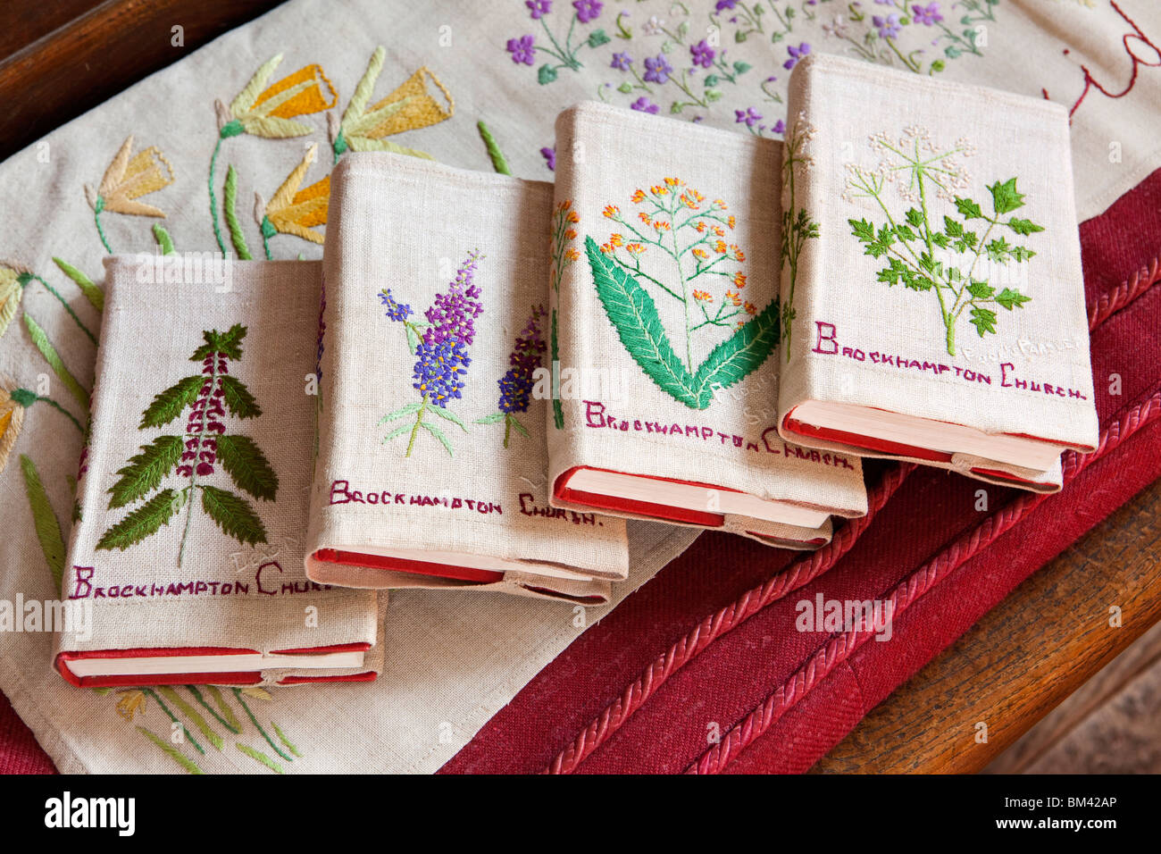 UK, Herefordshire, Brockhampton, All Saints Arts and Crafts Church, interior, embroidered hymn books Stock Photo