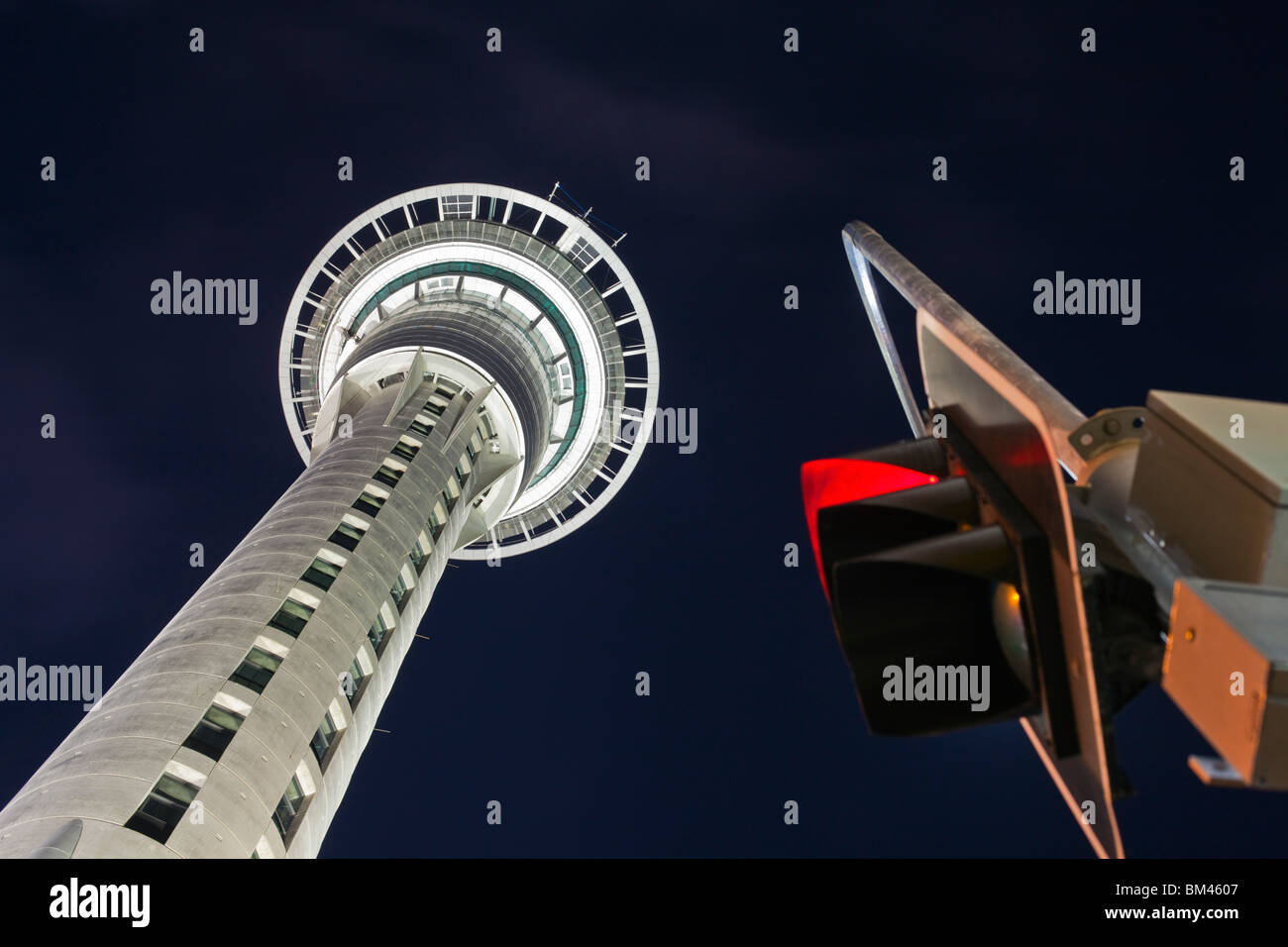 Traffic lights and the Sky Tower at night. Auckland, North Island, New