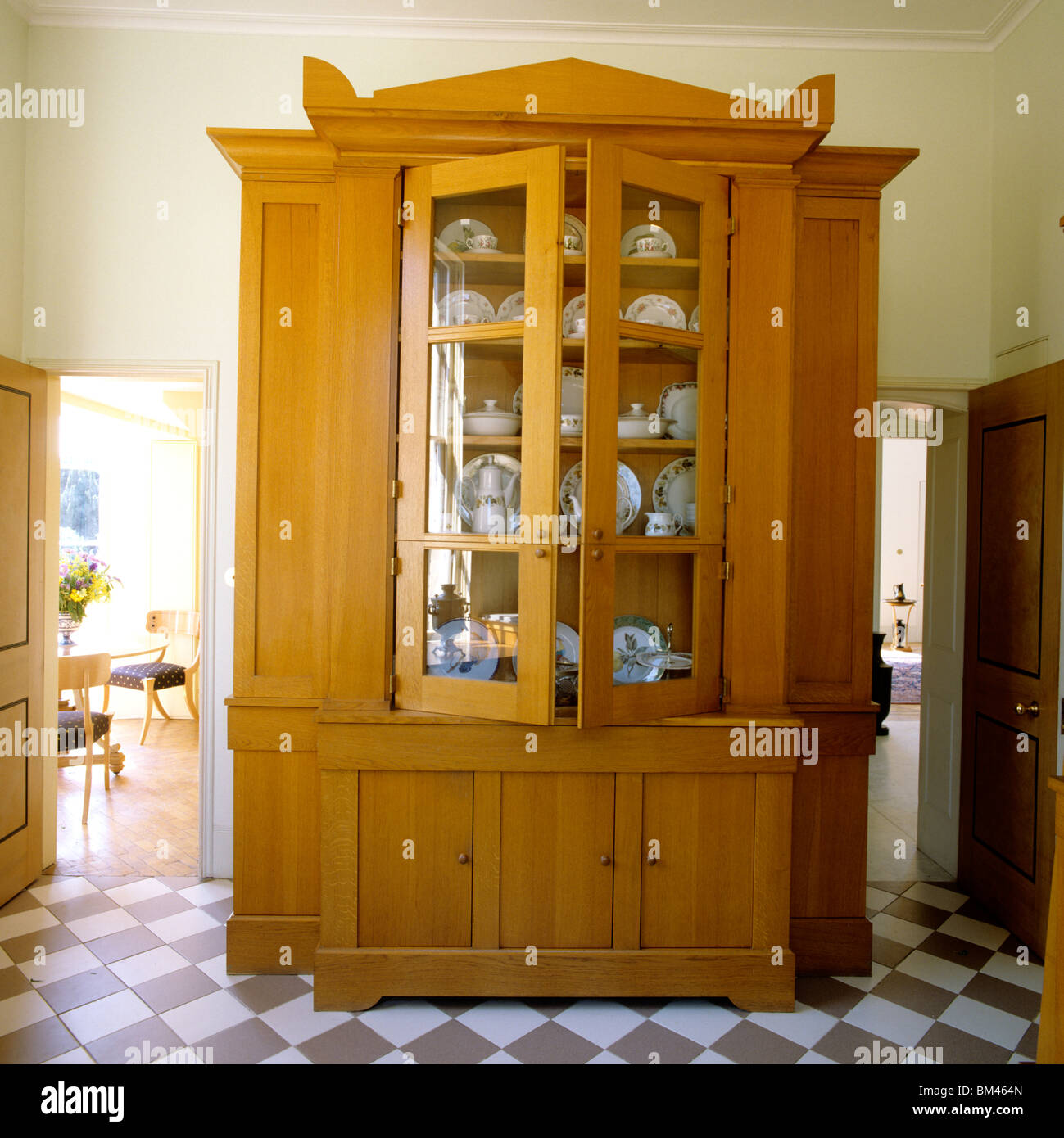 Large wooden dresser in tiled hallway of a new-built neo-classical villa designed by John Simpson Stock Photo