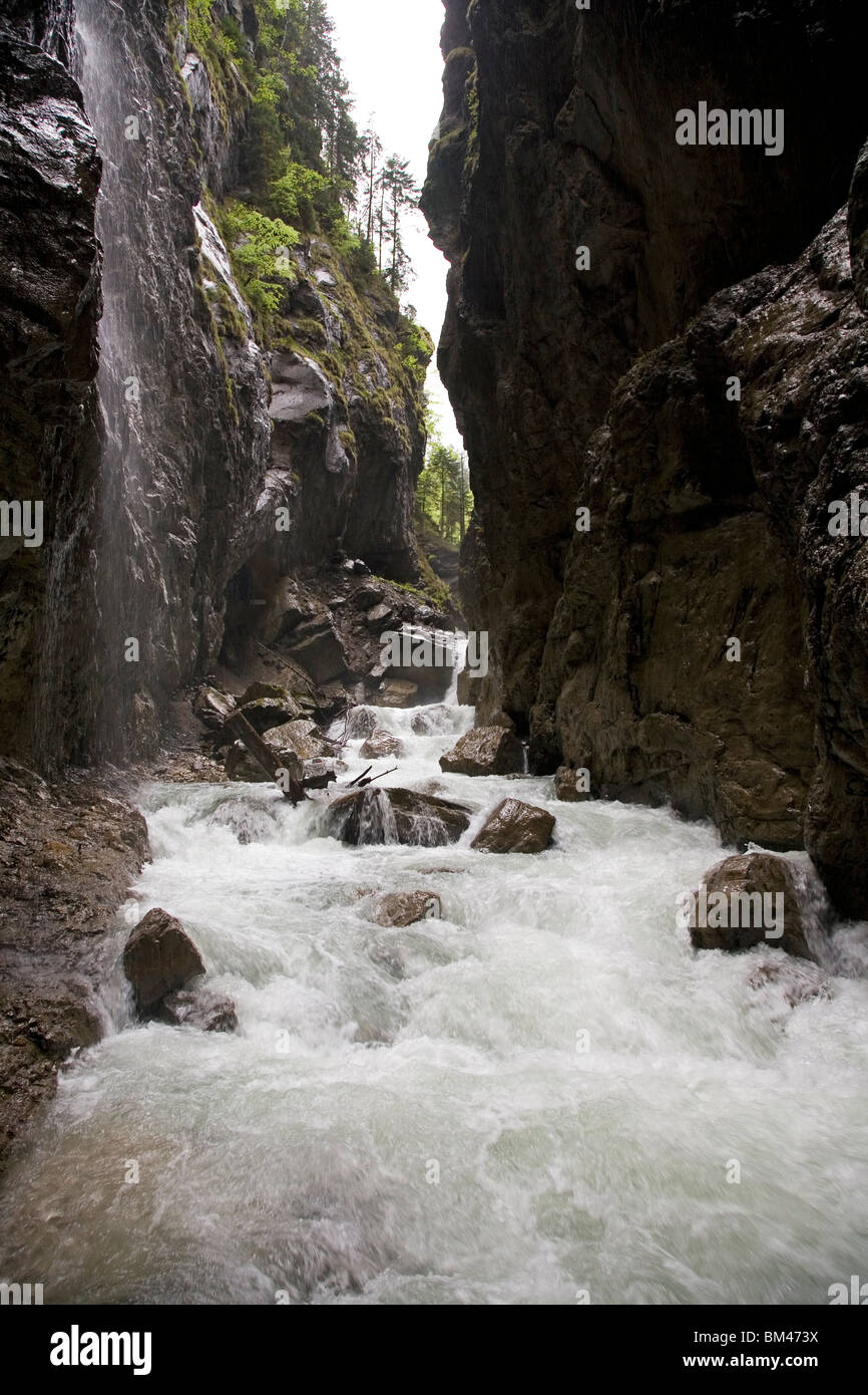 Water flows through the gorge at the Partnachklamm in Garmisch ...