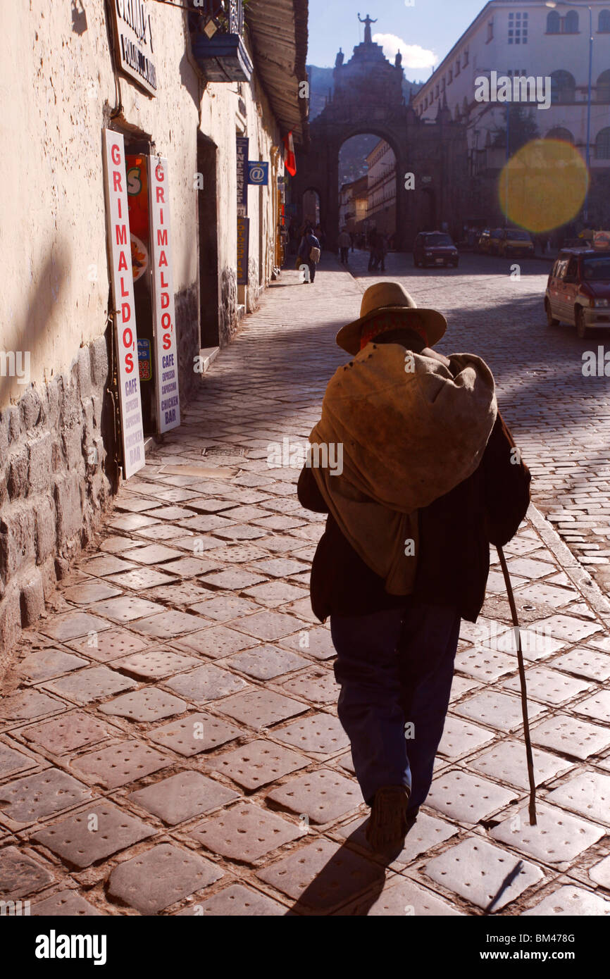 Old man on the streets of Cuzco is silhouette Stock Photo