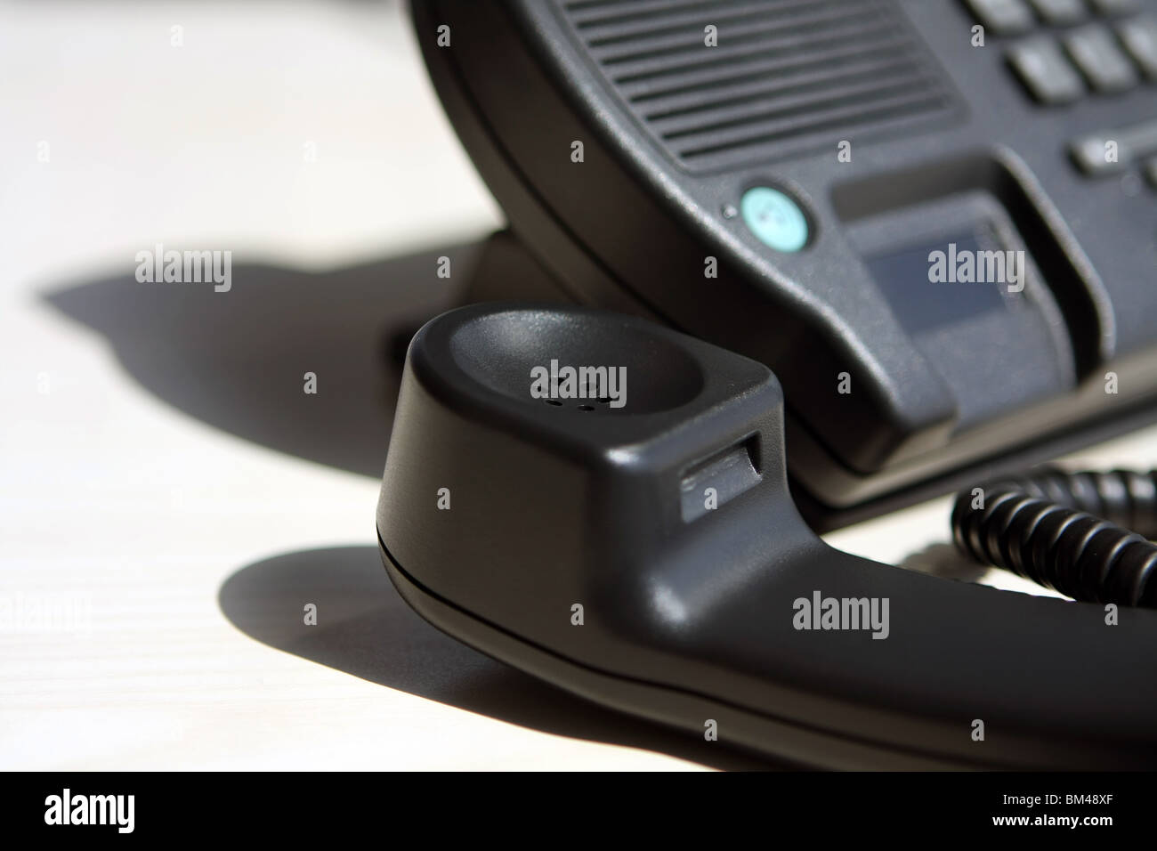 part of a telephone with the receiver off the hook Stock Photo Alamy