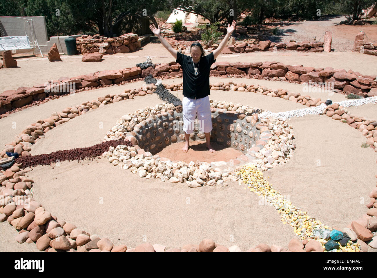 Medicine wheel shamanic circle healing earth energy vortex sacred site with psychic Brian Sedona Arizona USA Stock Photo