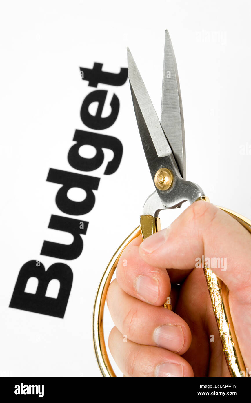 text of Budget and scissors, concept of Budget cut Stock Photo
