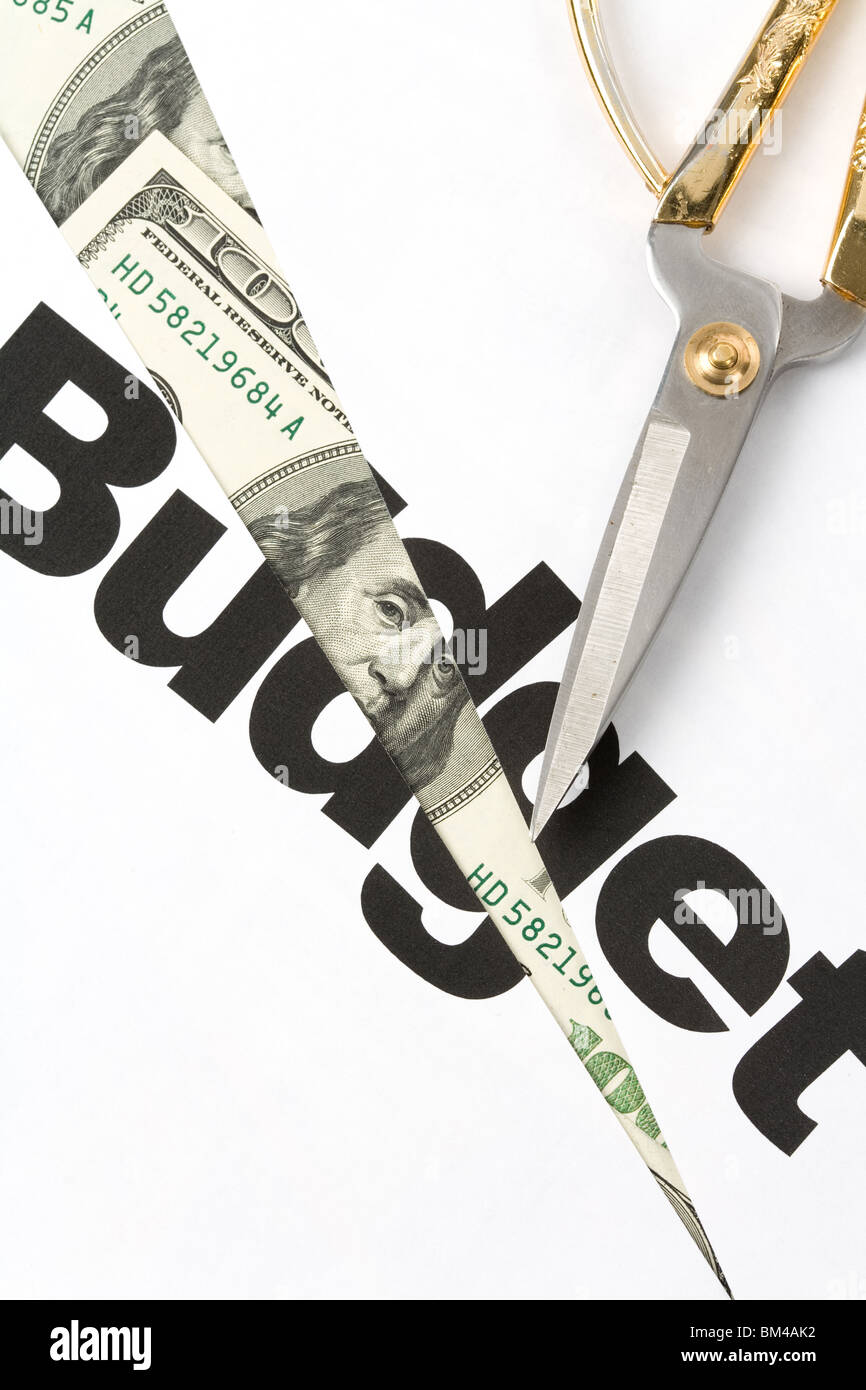 text of Budget and scissors, concept of Budget cut Stock Photo