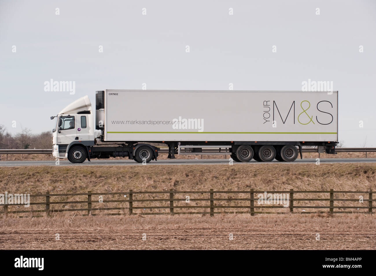 A lorry transporting goods for Marks & Spencer, travelling along a motorway. Stock Photo