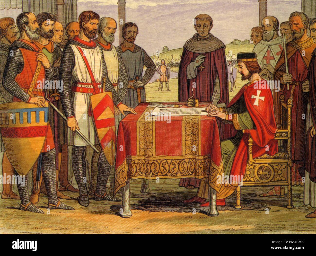 KING JOHN signs the Magna Carta at Runneymede in June 1215 watched by a group of Barons Stock Photo