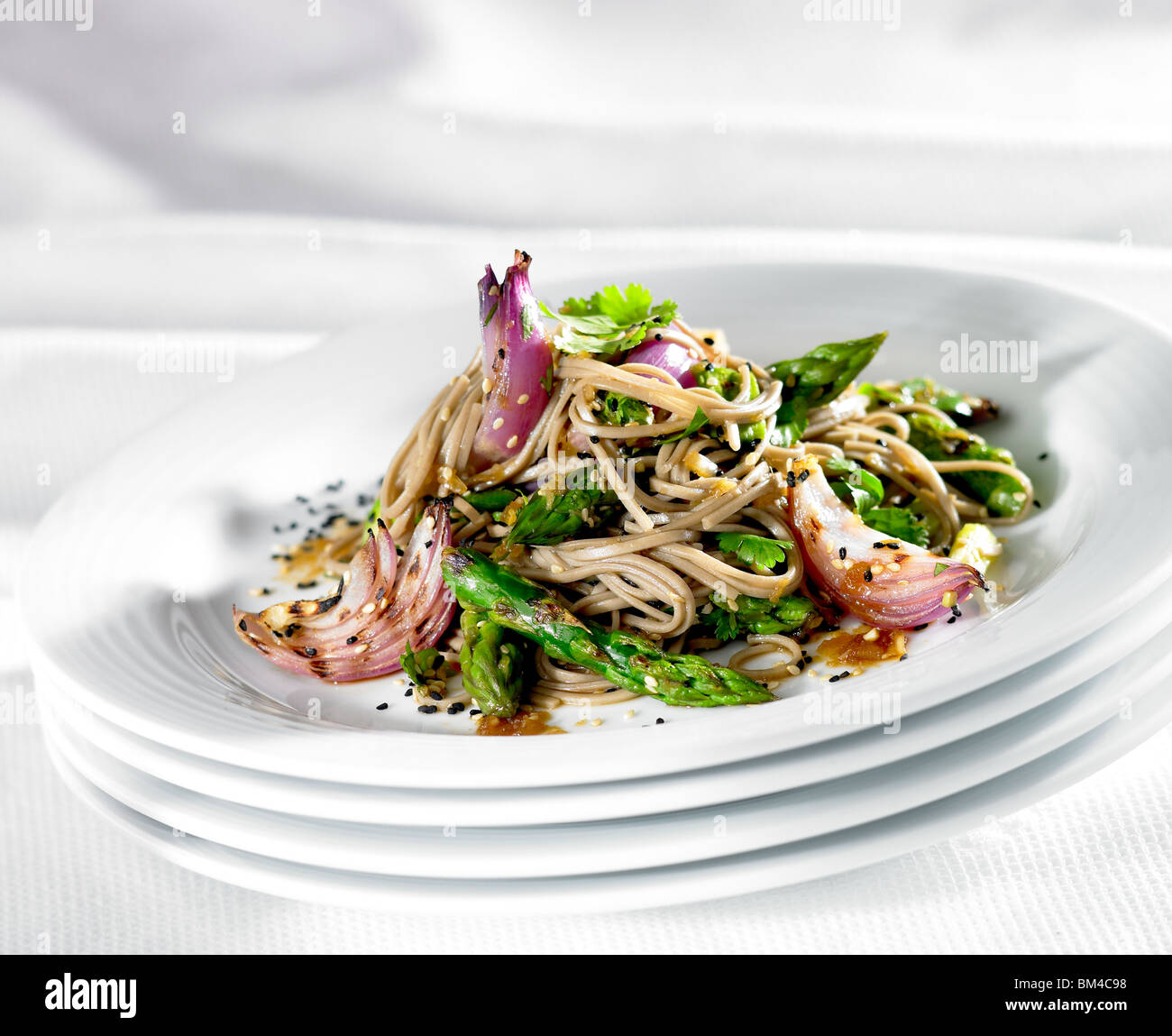 Asparagus and red onions with noodles Stock Photo