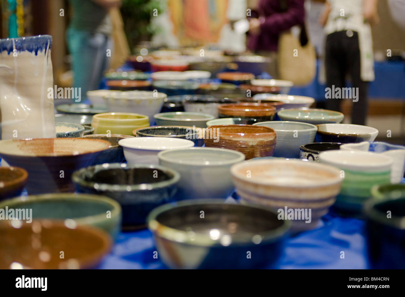 Table full of handmade ceramic bowls Stock Photo