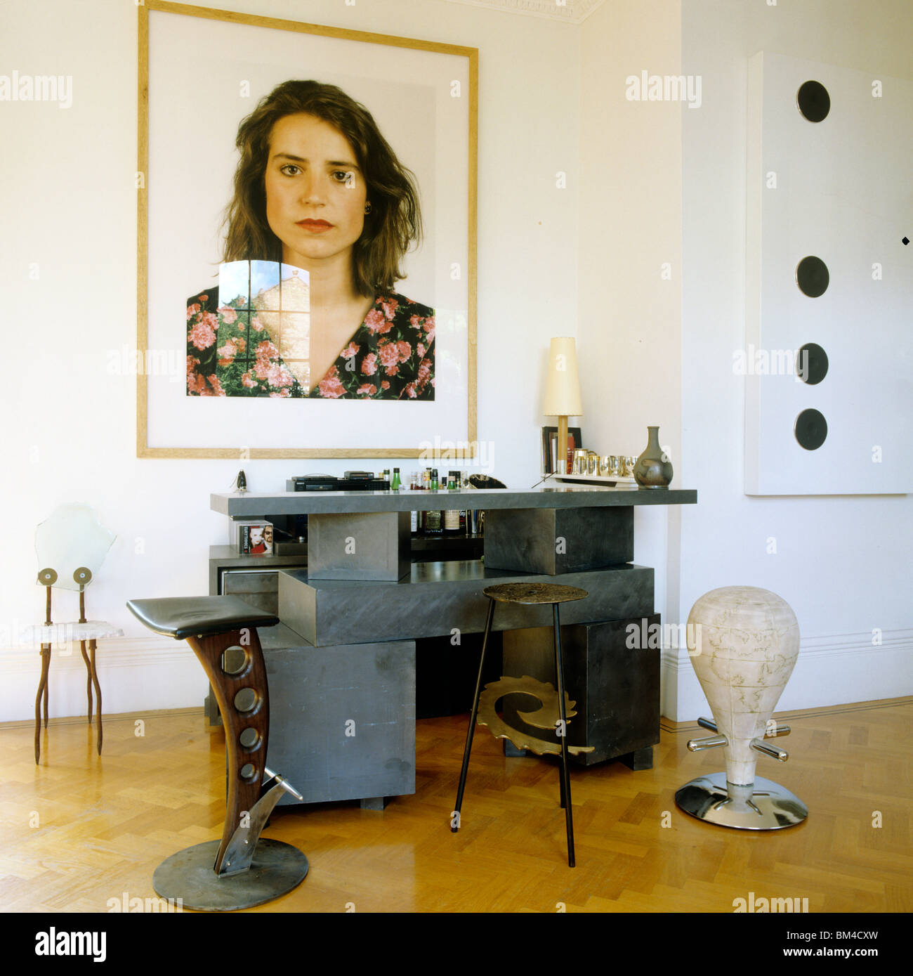 Portrait by Thomas Ruff with chairs by Ron Arad and Rolf Sachs in home