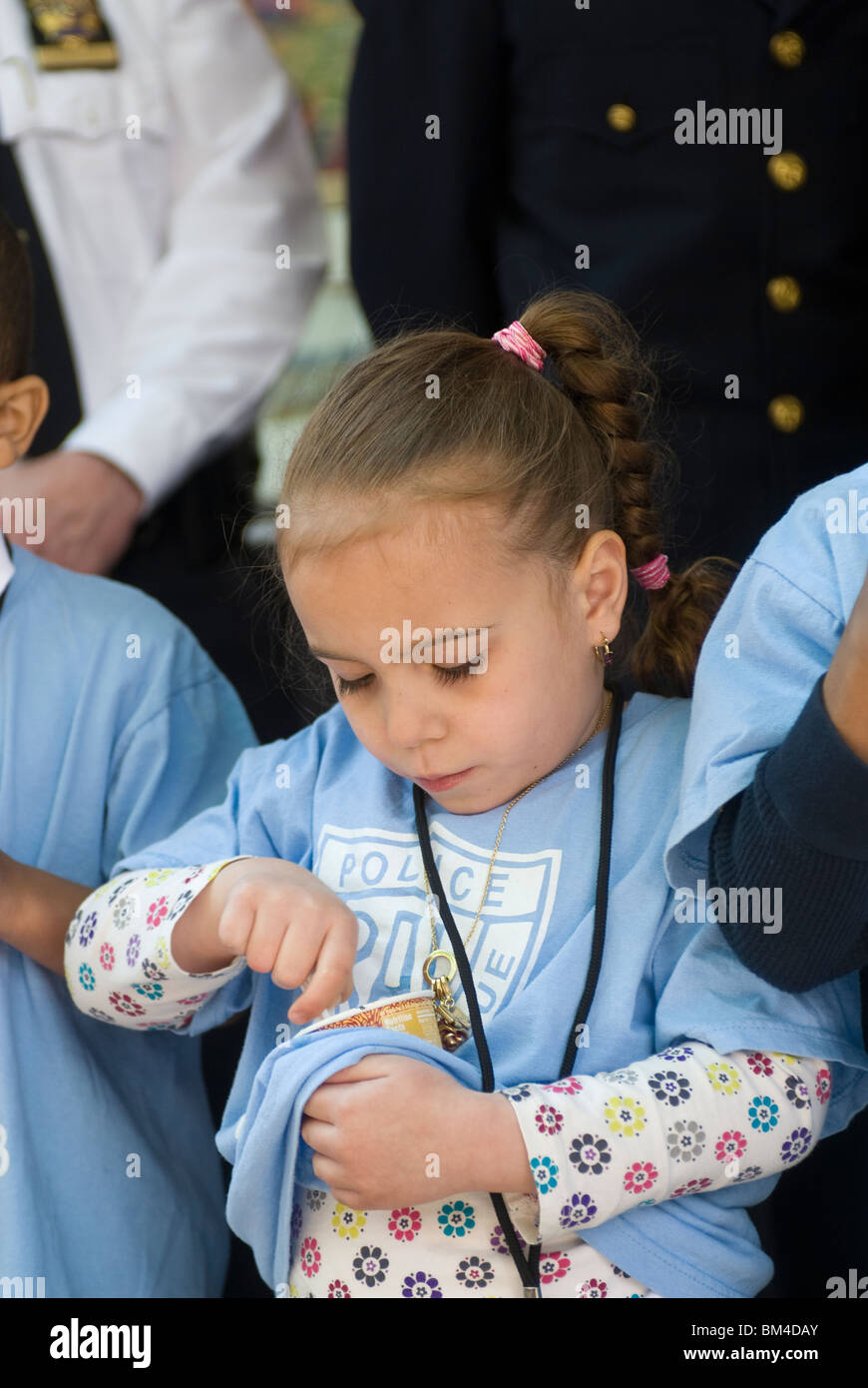 Children from the Police Athletic League eat Haagen-Dazs ice cream in New York Stock Photo