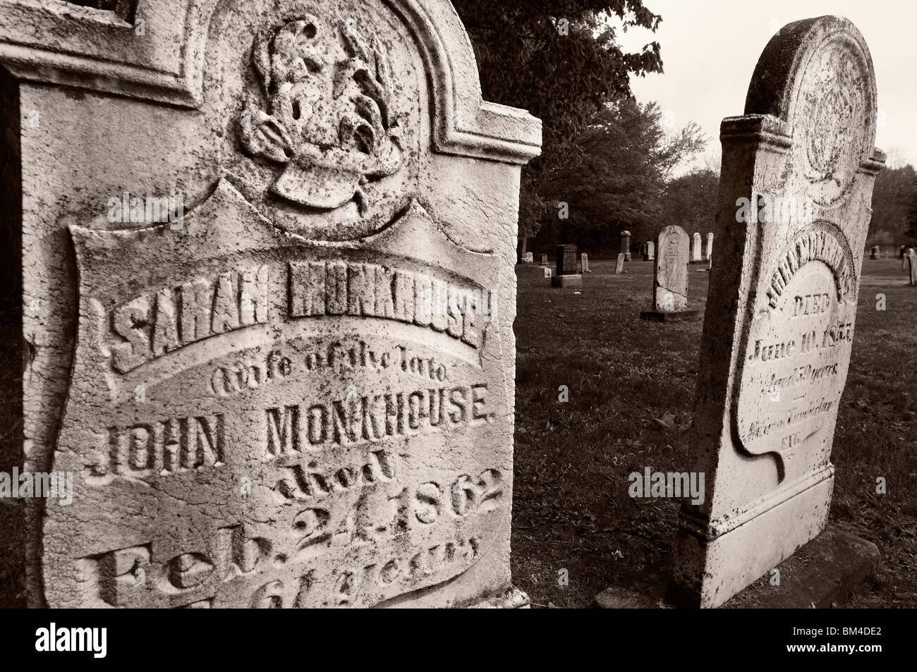 Husband and wife headstones at a historic Mennonite church graveyard in Altona Ontario in monochrome Stock Photo