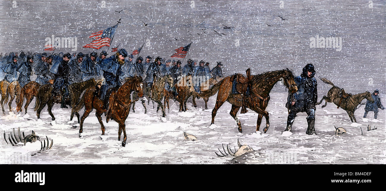 General Custer's cavalry marching to attack a Cheyenne village on the Great Plains, 1868. Hand-colored woodcut Stock Photo