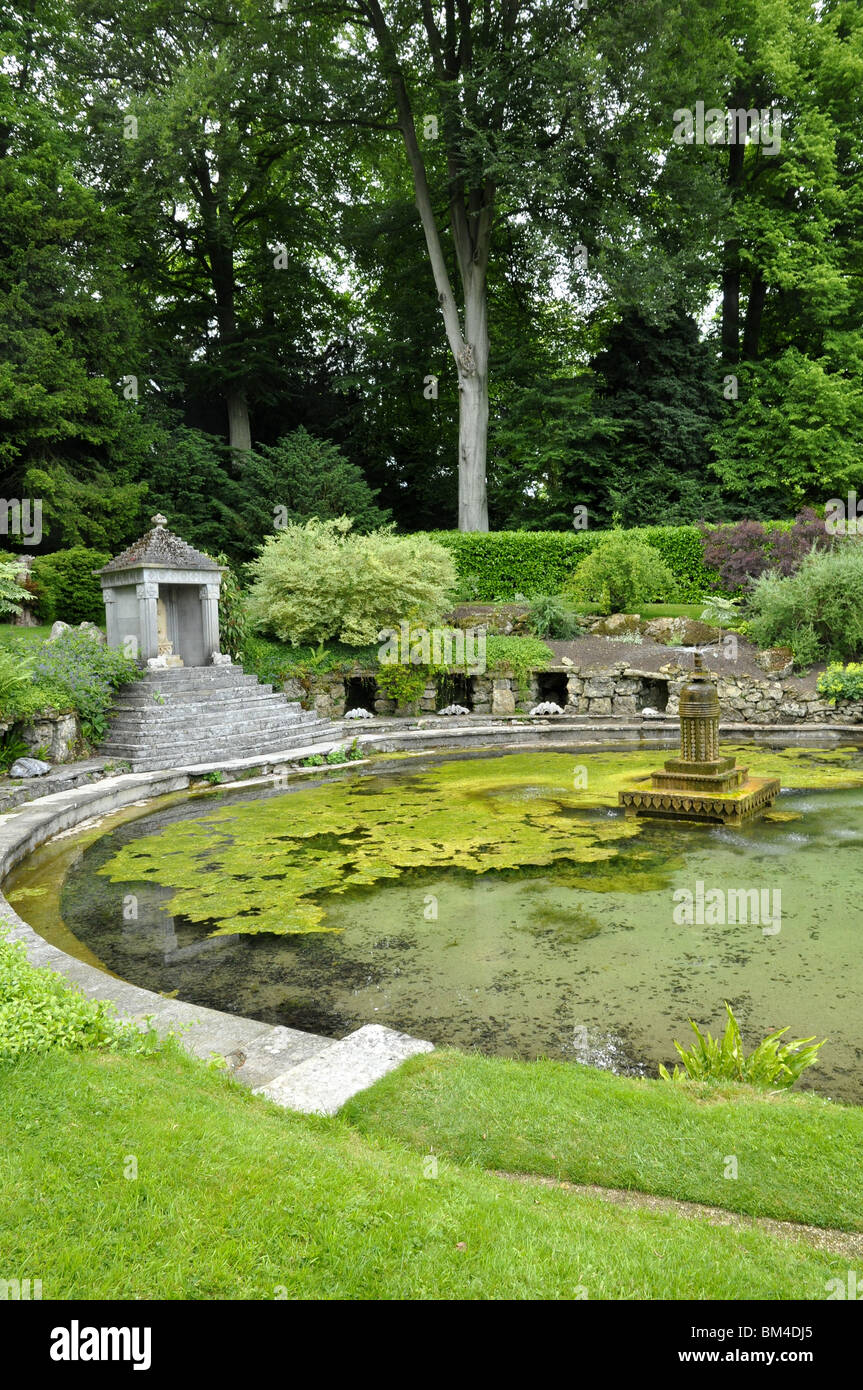 Sezincote garden pool with fountain and oriental temple.  Cotswolds, Gloucestershire, UK Stock Photo