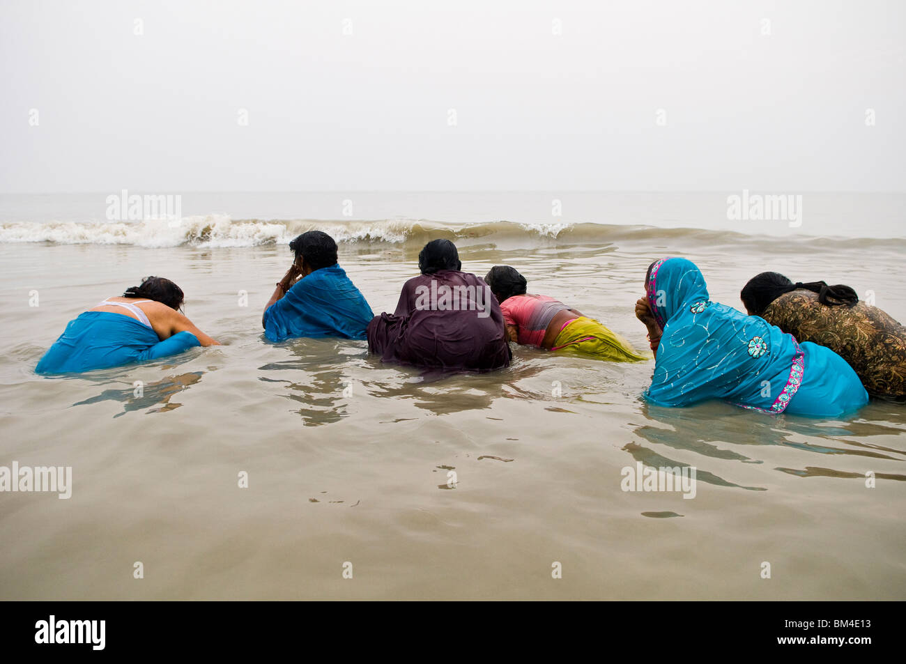 Pilgrims bath in the holy water of Gangasagar island in west Bengal. Stock Photo