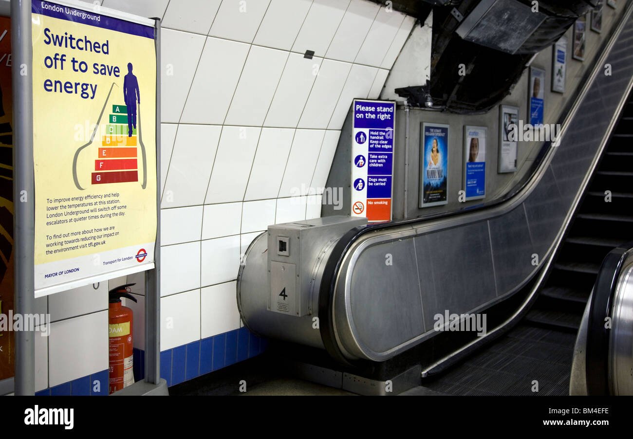 Notice about energy saving by London underground escalator Stock Photo