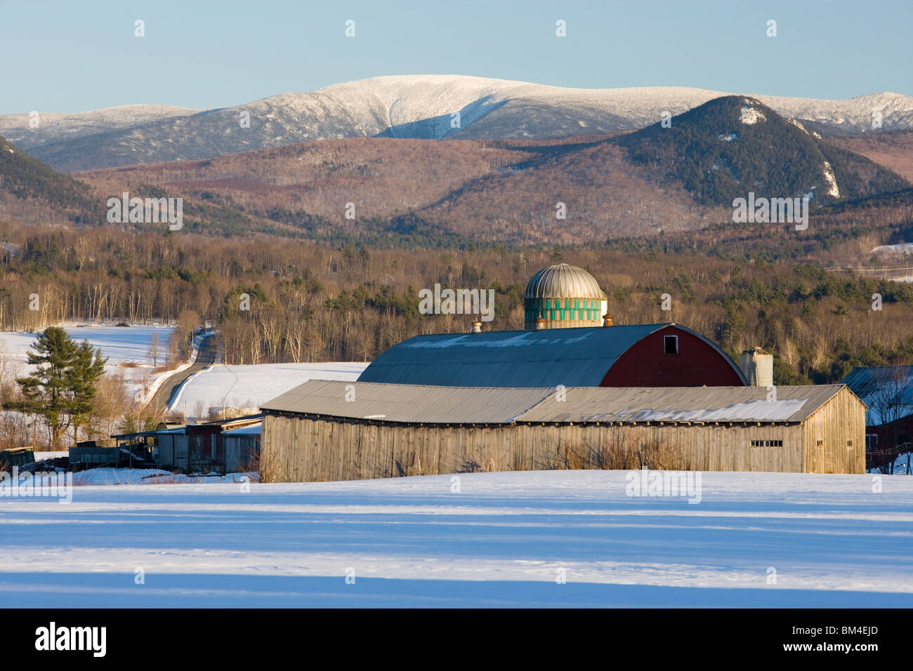 A farm in winter in North Haverhill, New Hampshire.  Mount Moosilauke is in the distance. Stock Photo