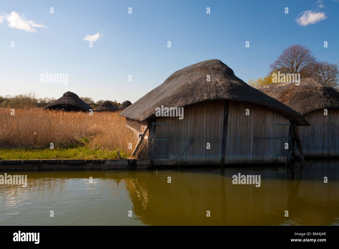 Hickling Heath Norfolk Broads with thatched boat houses Stock Photo