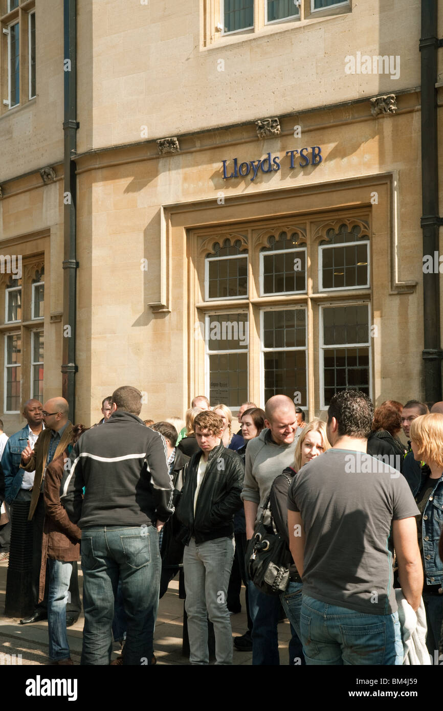 A crowd of people outside Lloyds TSB, market square branch, Cambridge city centre, UK Stock Photo