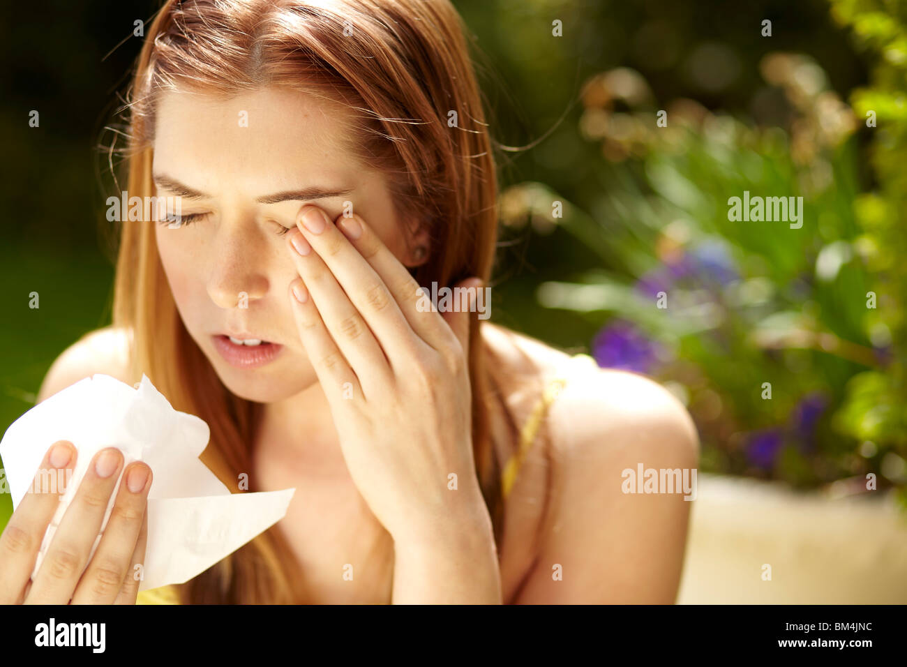 Girl sneezing Stock Photo