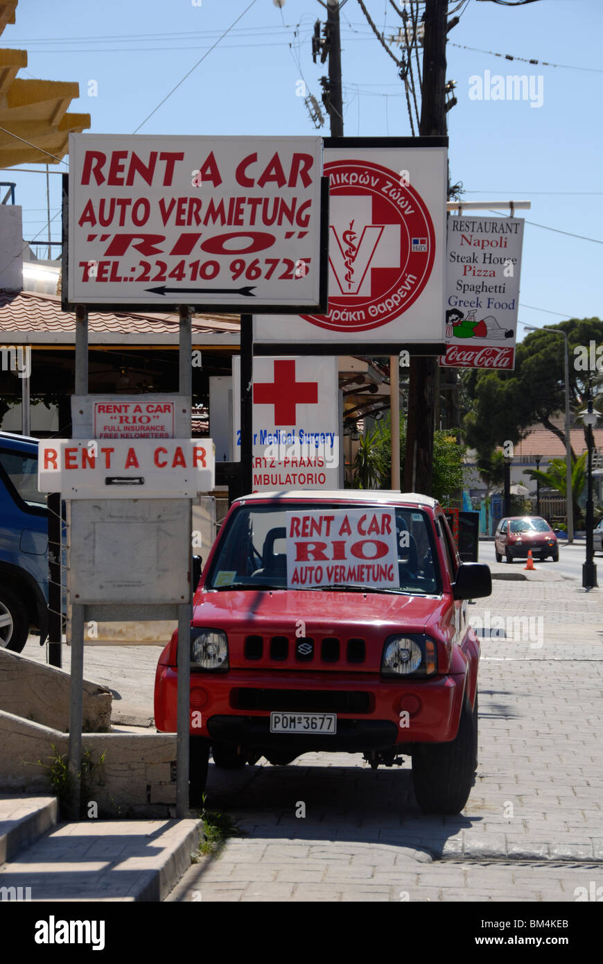 greece rent a car rental shop sign street Stock Photo