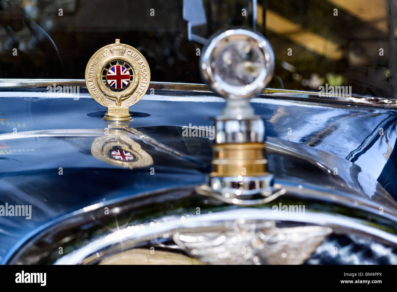 Royal Automobile Club Association badge mounted on the bonnet of a classic car. Foreground focus. Stock Photo