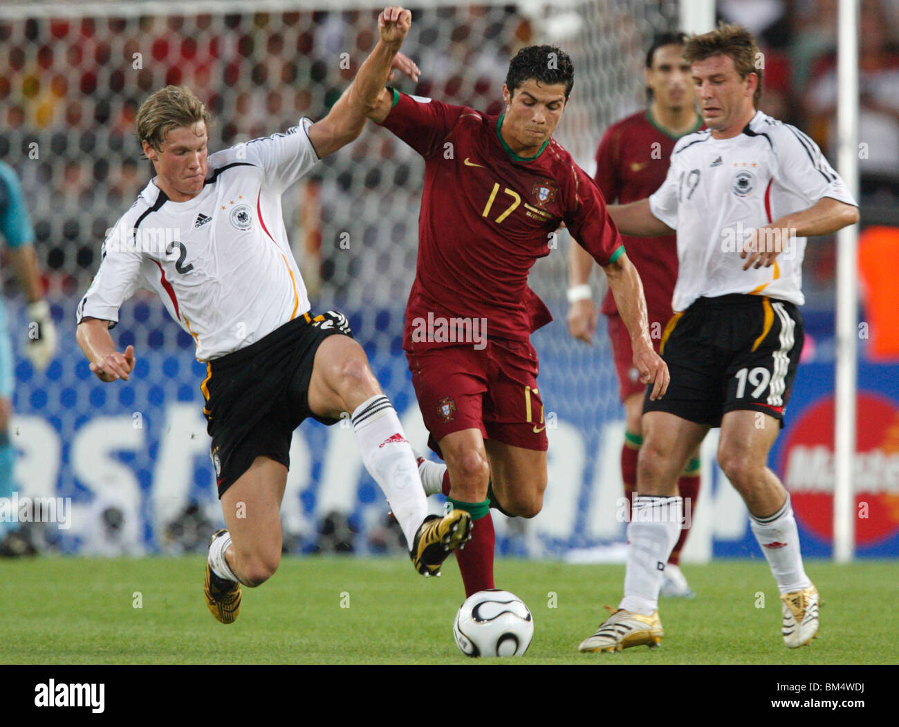 Marcell Jansen of Germany (2) defends against Cristiano Ronaldo of Portugal (17) during the 2006 World Cup third place match. Stock Photo