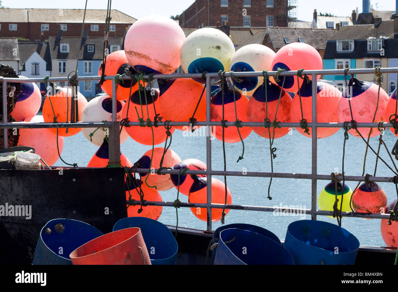 Boat Fenders and Buoys on the side of a fishing Trawler docked in