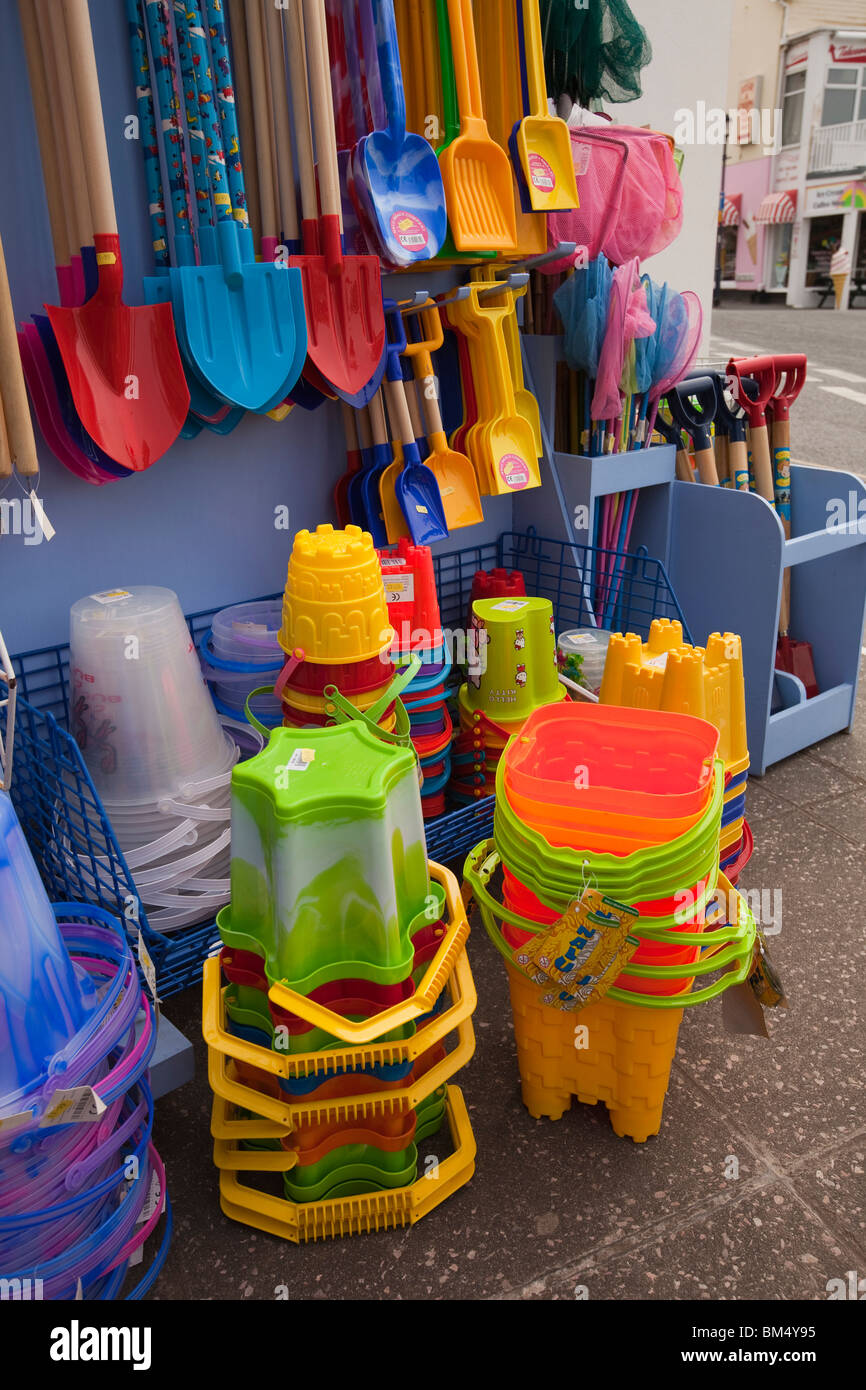 UK, England, Devon, Woolacombe, tourist economy, buckets and spades for sale in beach supplies shop Stock Photo