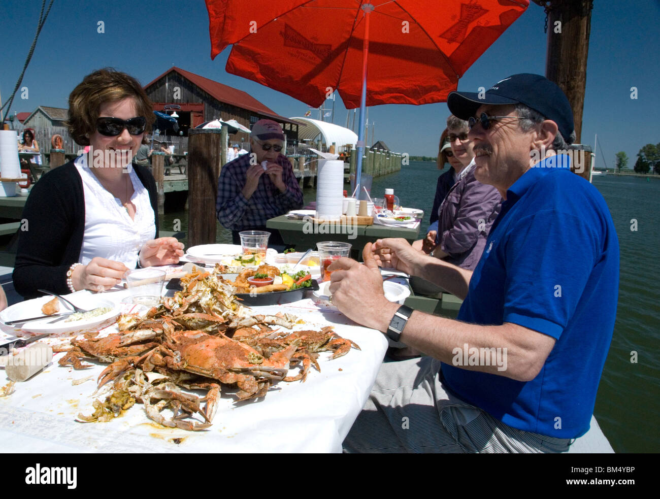 Diners eating Chesapeake Bay crabs at The Crab Claw Restaurant St Michaels Chesapeake Bay Maryland MD USA Stock Photo