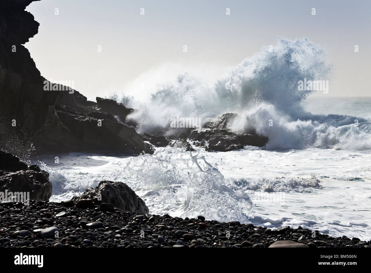 Heavy Atlantic seas with large waves crashing onto the beach at Ajuy on the Canary Island of Fuerteventura Stock Photo
