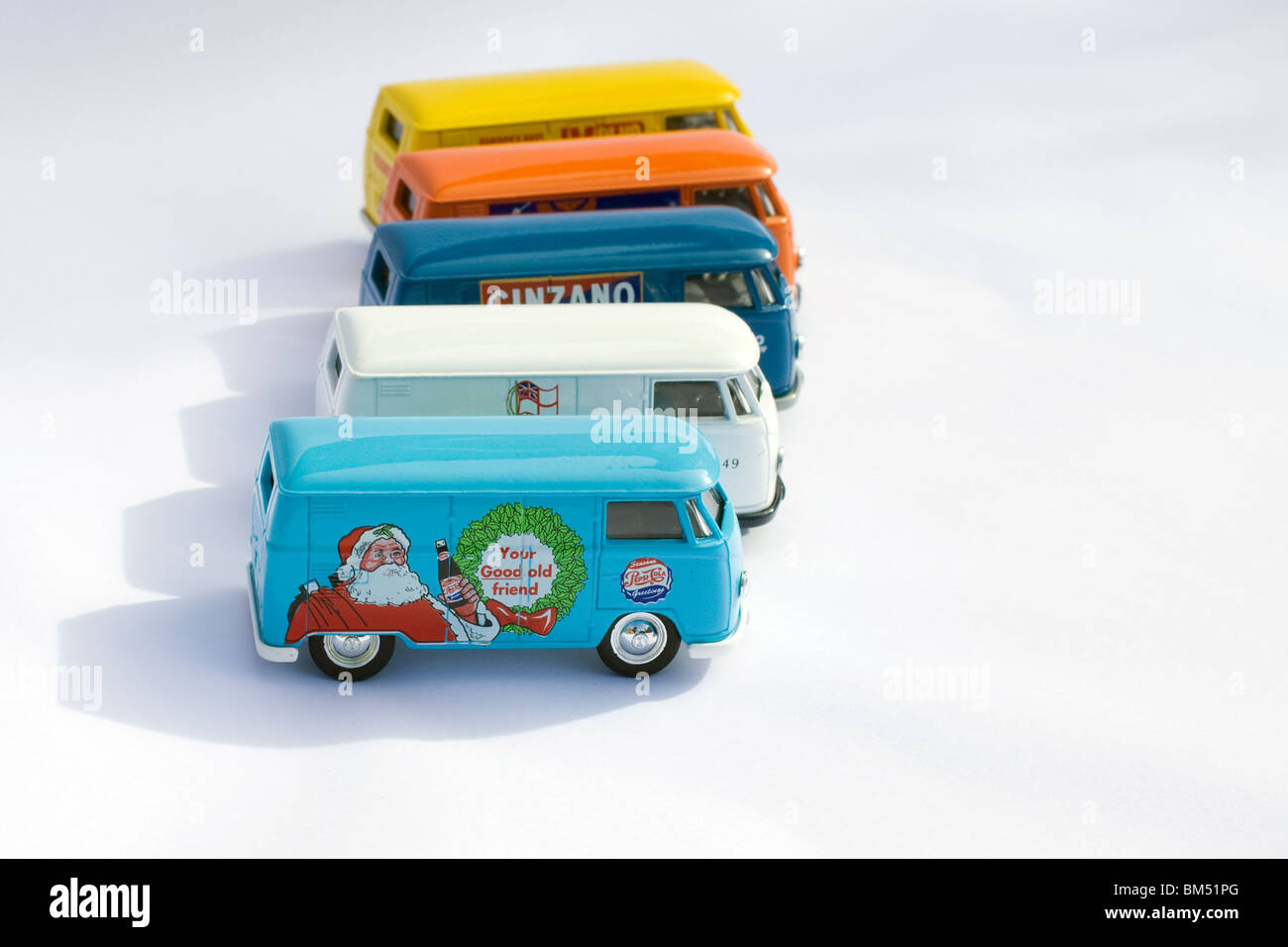 Children's collectible toy model of Five Volkswagen split screen panel vans on white background Stock Photo