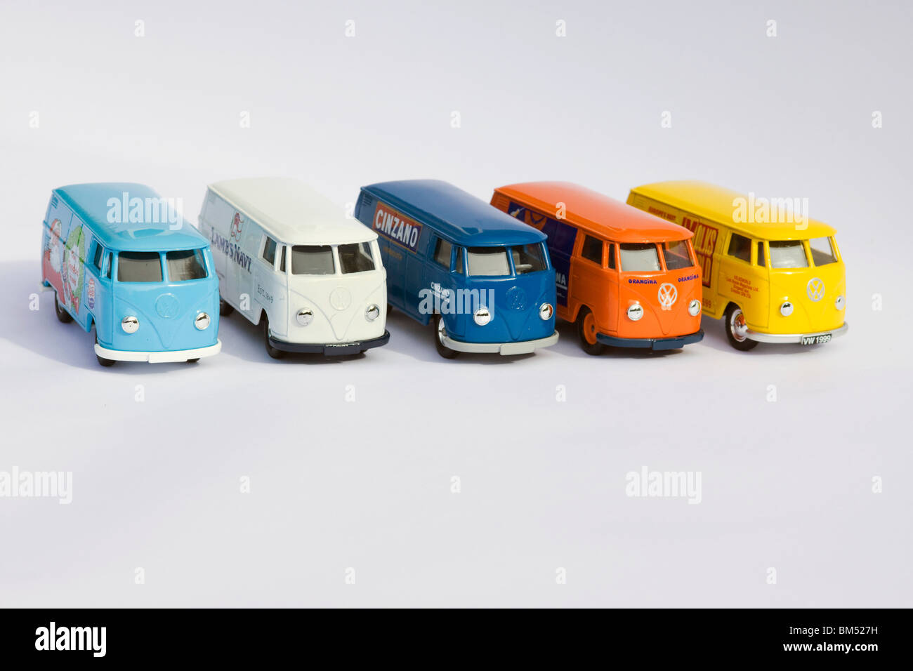 Children's collectible toy model of Five Volkswagen split screen panel vans on white background Stock Photo