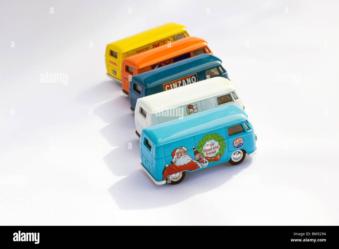 Children's collectible toy model of Five  Volkswagen split screen panel vans on white background Stock Photo