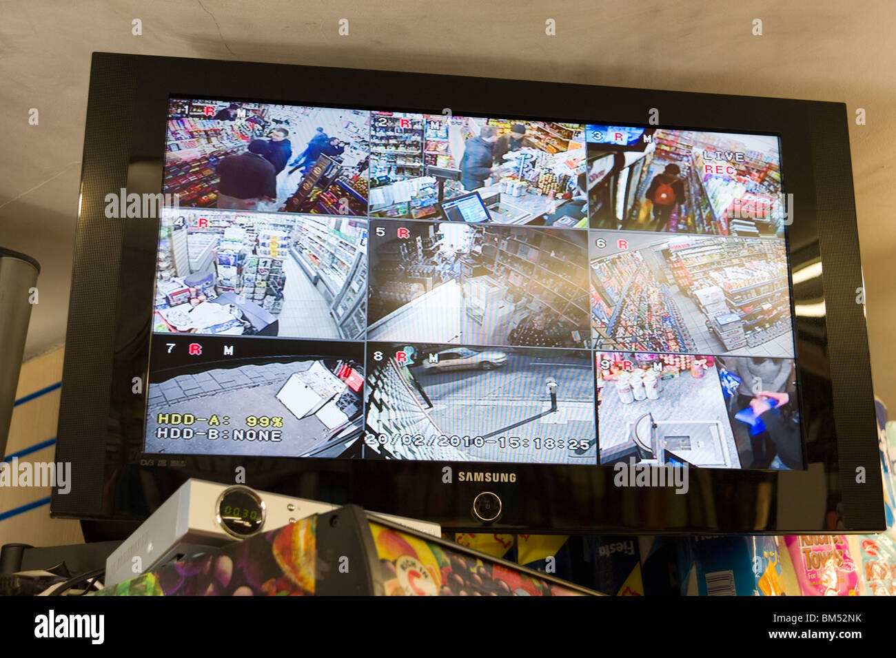 Local grocery shop's screen of the CCTV cameras around the store, UK Stock Photo