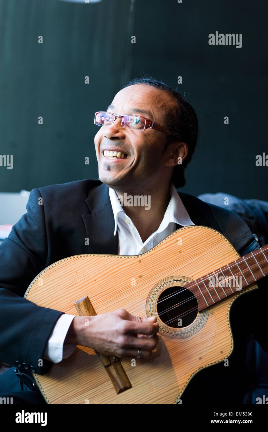 Musician Oscar Vazquez Romero playing a Cuban tres string instrument Stock Photo