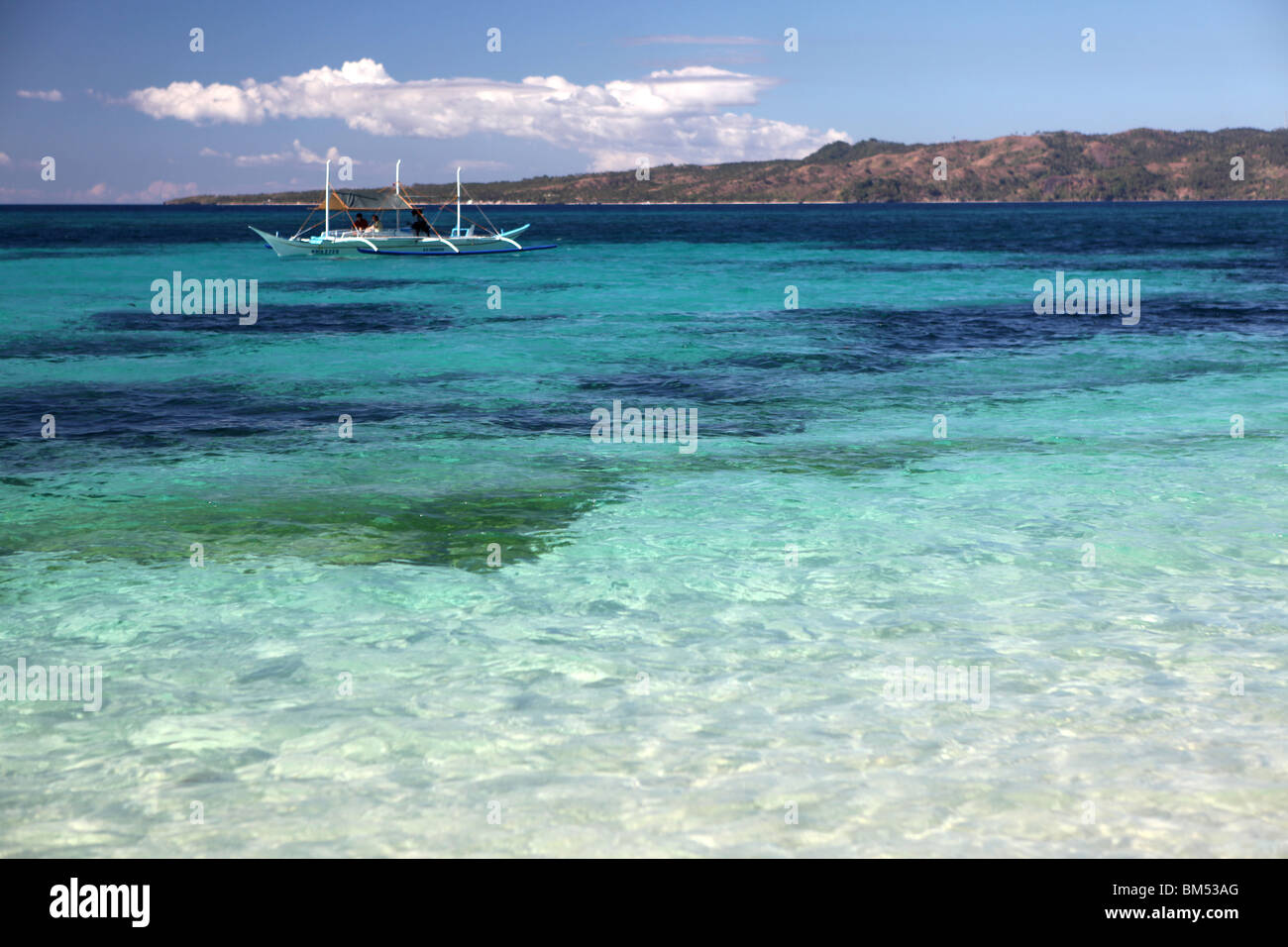 Boats at Puka Beach at the northern end of Barocay Island in the Visayas region of Philippines. Stock Photo