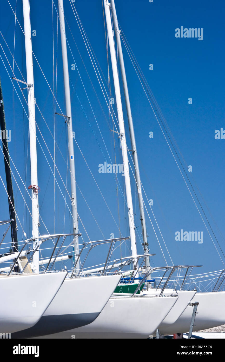 Sailboats in a row on trailers Stock Photo