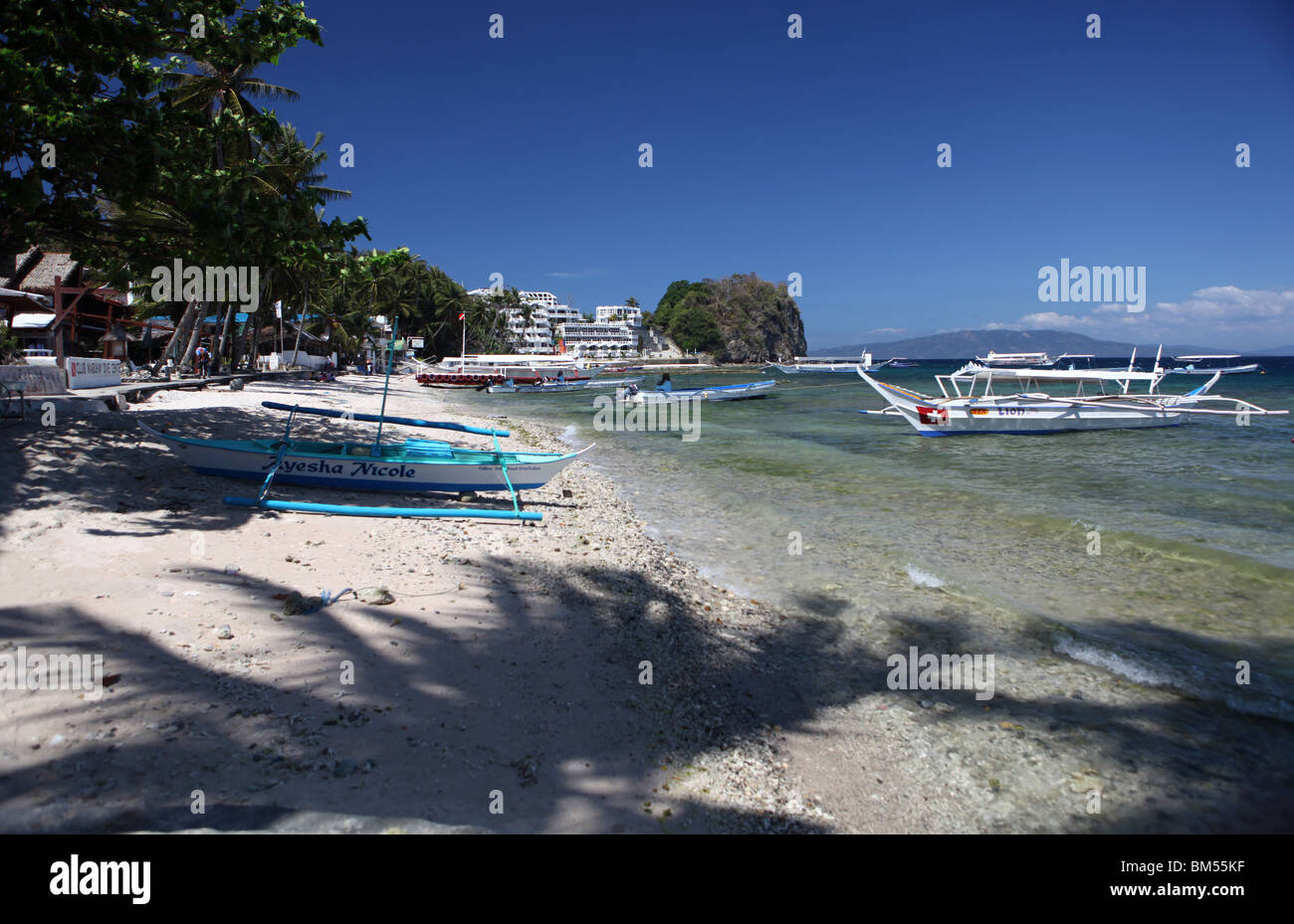 Small La Laguna Beach in Puerto Galera, located on the north of Mindoro Occidental in the Philippines. Stock Photo