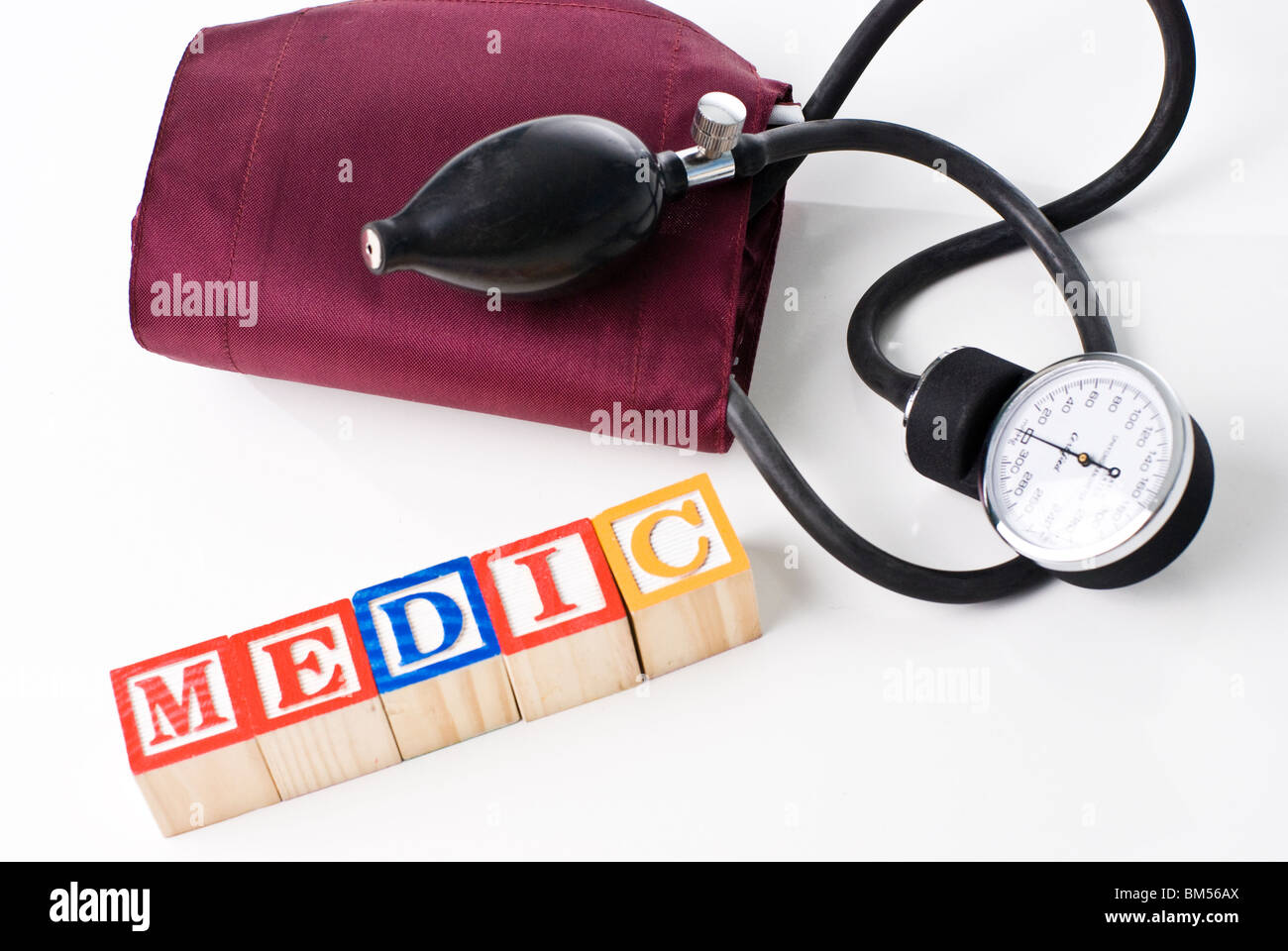 Colorful children's blocks spelling MEDIC with a blood pressure cuff Stock Photo