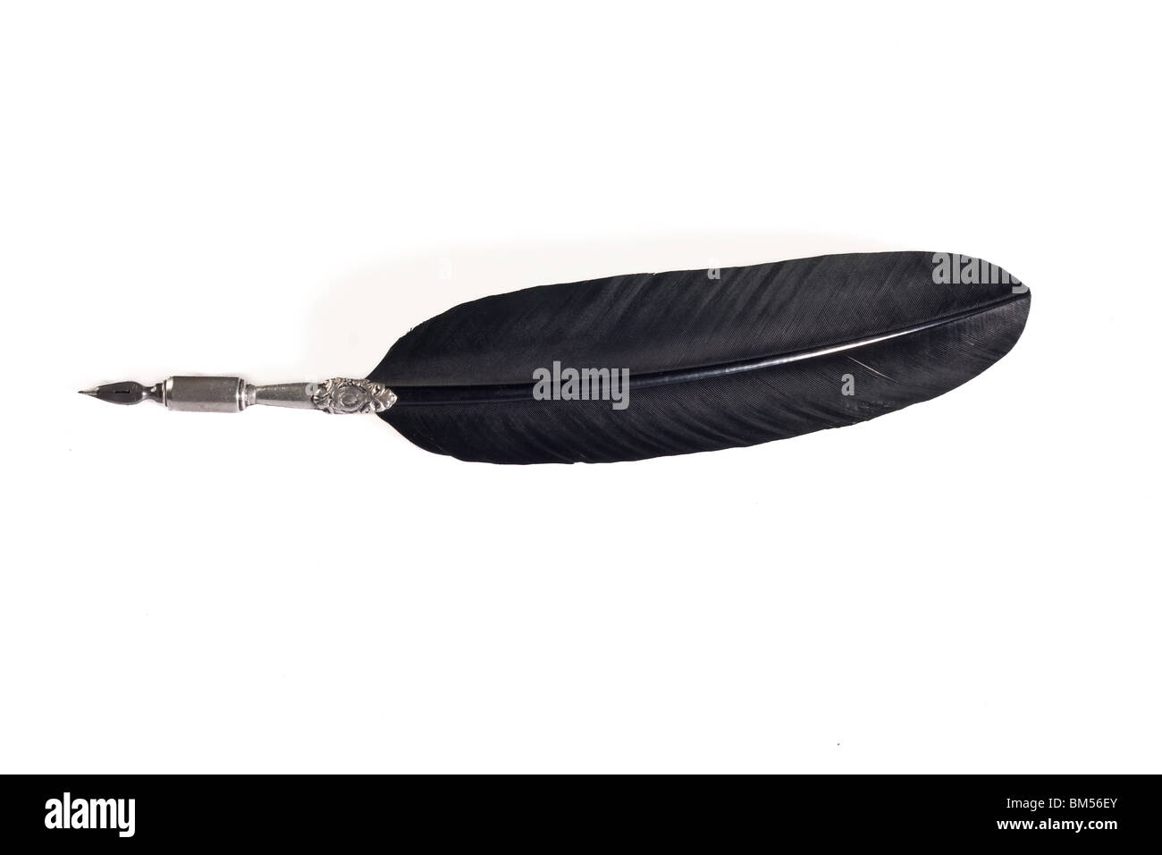 Quill pen made out of silver metal and black feather isolated on white