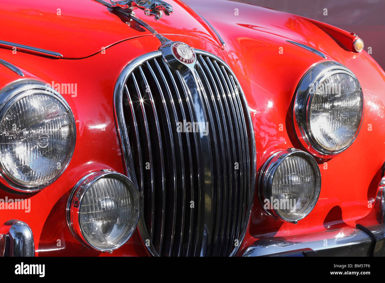 Close-up front view of a red Mark 2 3.8 litre Jaguar. Stock Photo