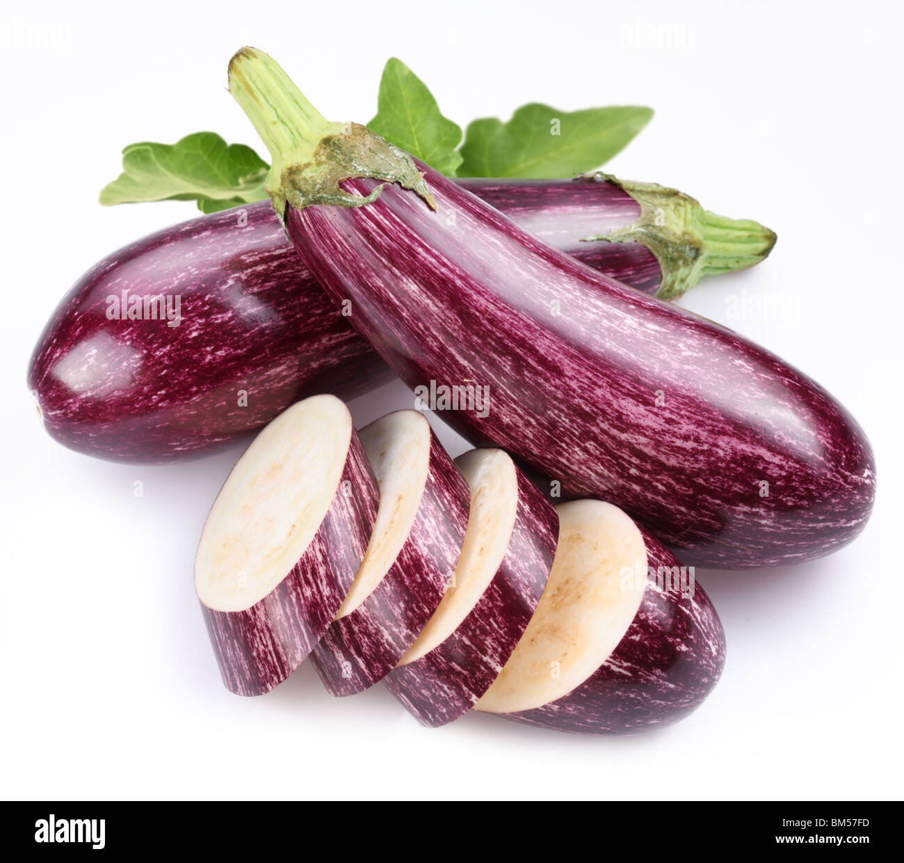 Purple eggplants with leaves on white background Stock Photo Alamy
