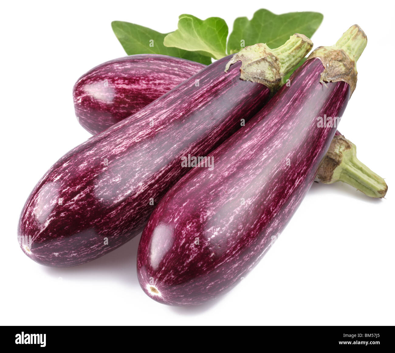 Purple eggplants with leaves on white background Stock Photo Alamy