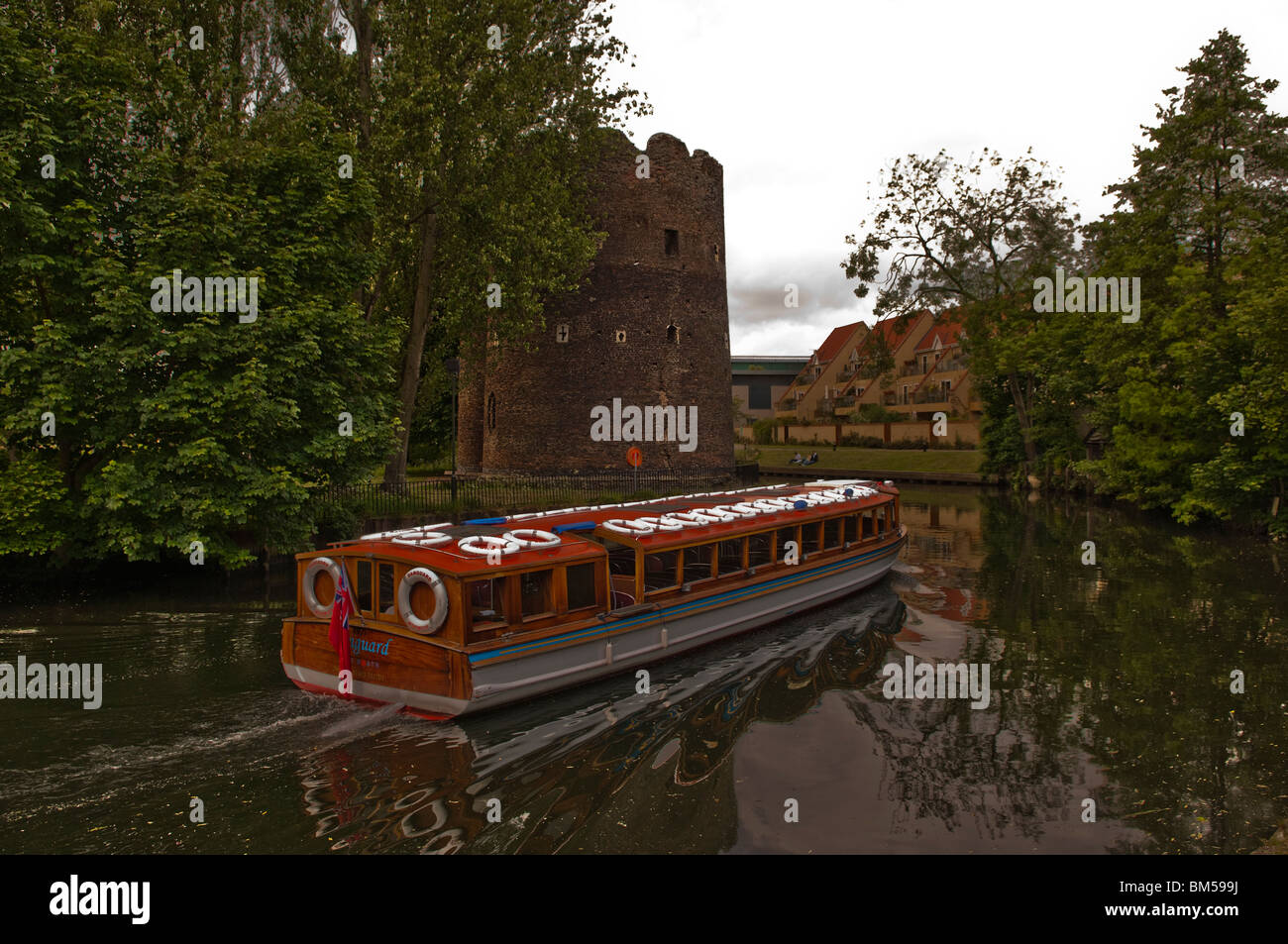 Pleasure boat on the fenland waters in Norwich adjacent to the old city walls, Stock Photo