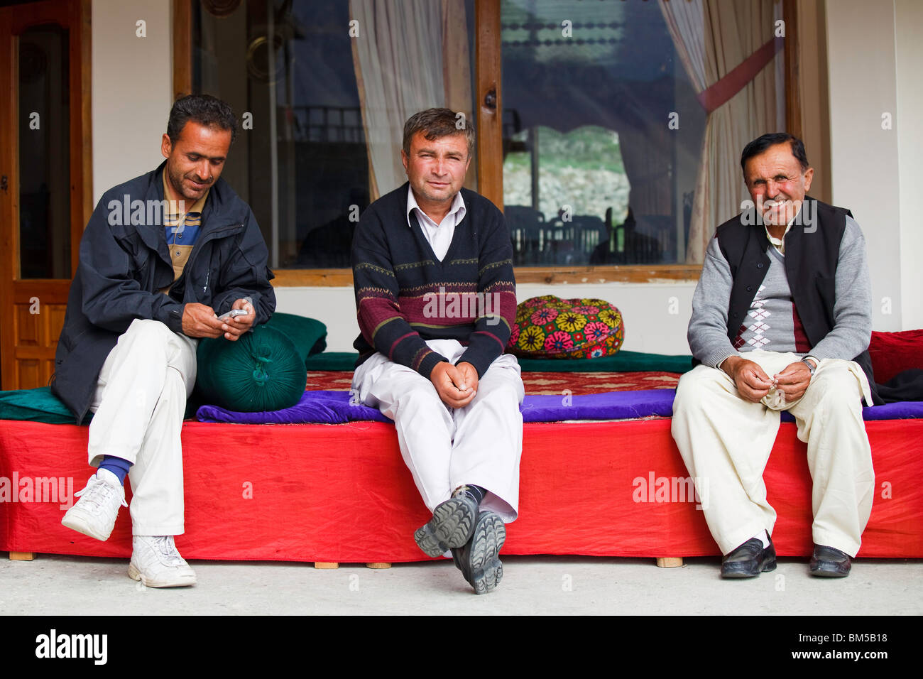 Three local mountain guides in Karimabad, Hunza Valley, Pakistan Stock Photo