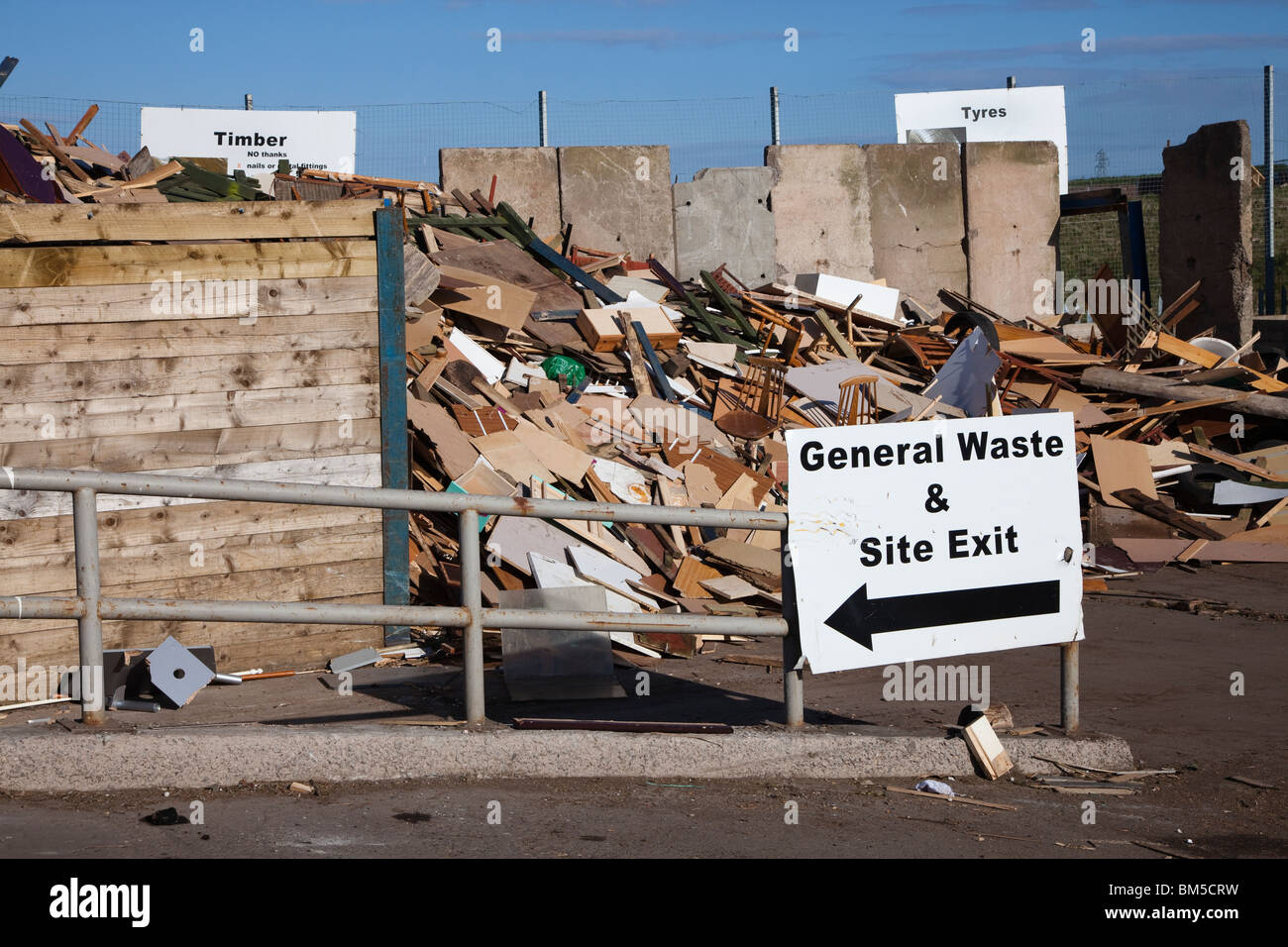 Rubbish tip with discarded timber, council owned waste disposal facility, near Kilmarnock, Scotland Stock Photo
