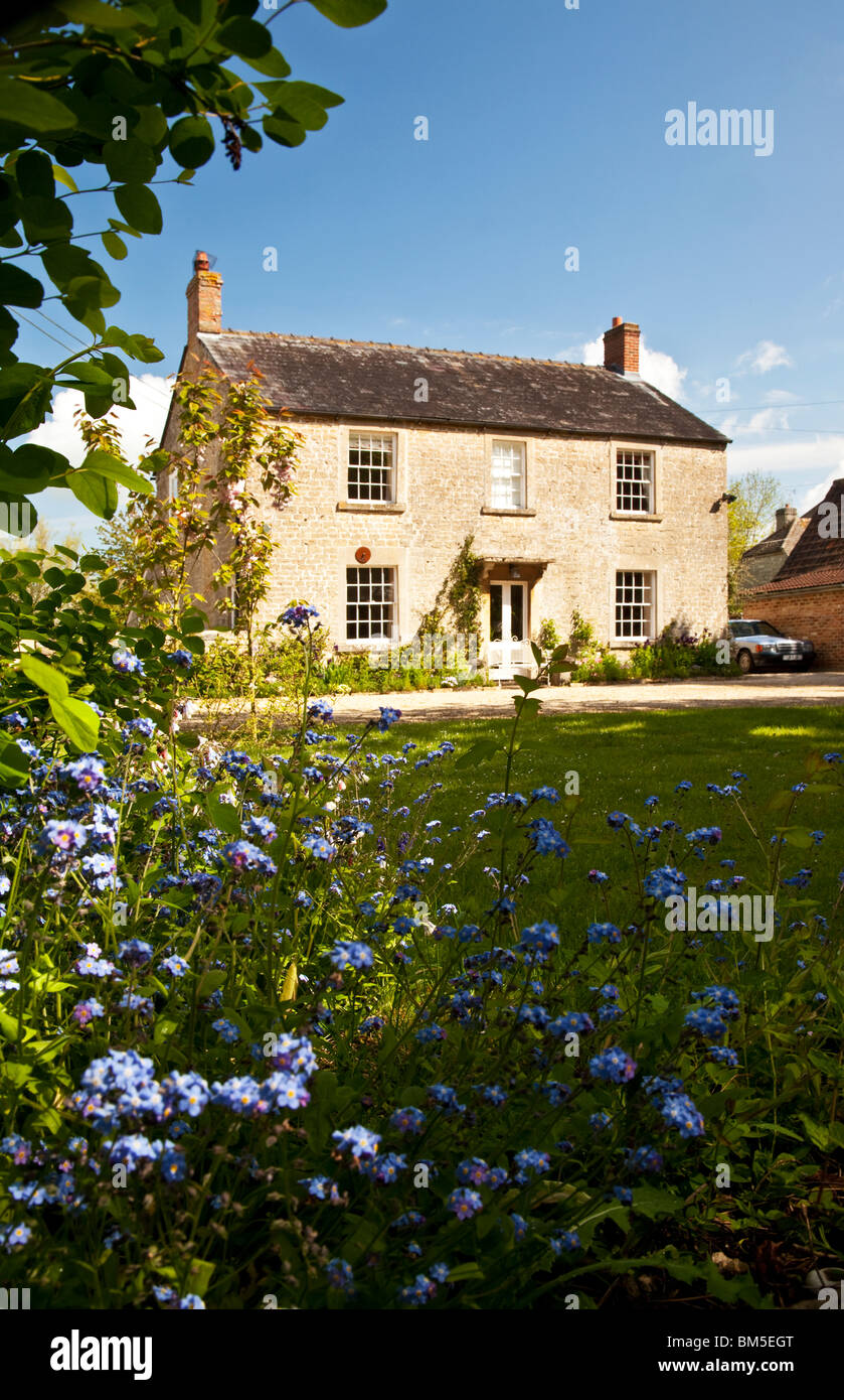 A pretty stone country house in the Wiltshire village of Great